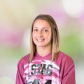 Suzanne smiling wearing maroon and black STAC tshirt