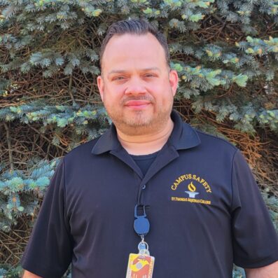 Aramis standing outside wearing Campus Safety black shirt