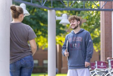 Smiling male student in Spartan sweatshirt