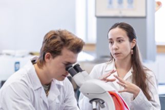 teacher and student in science lab