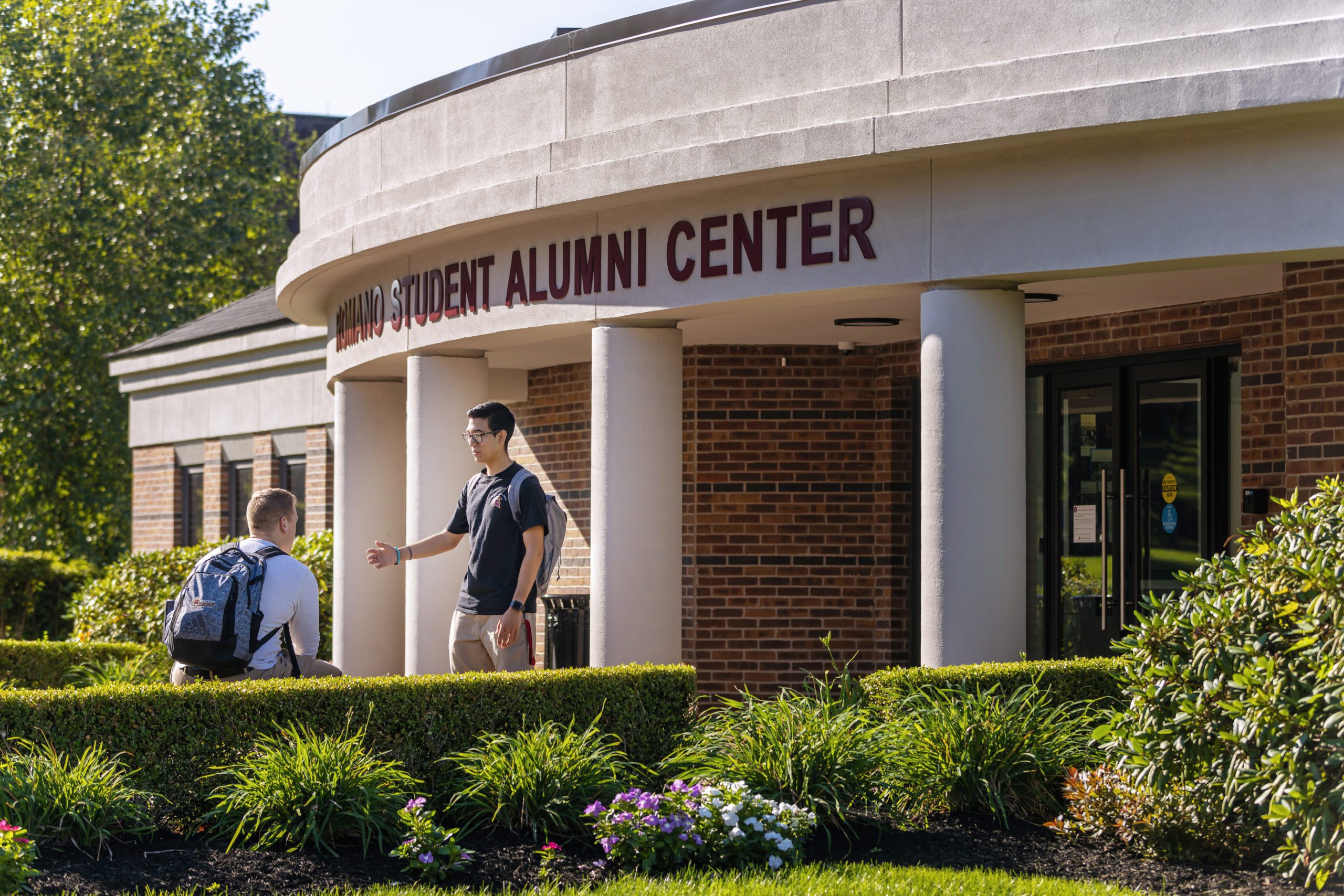 Students in front of Romano Alumni Center