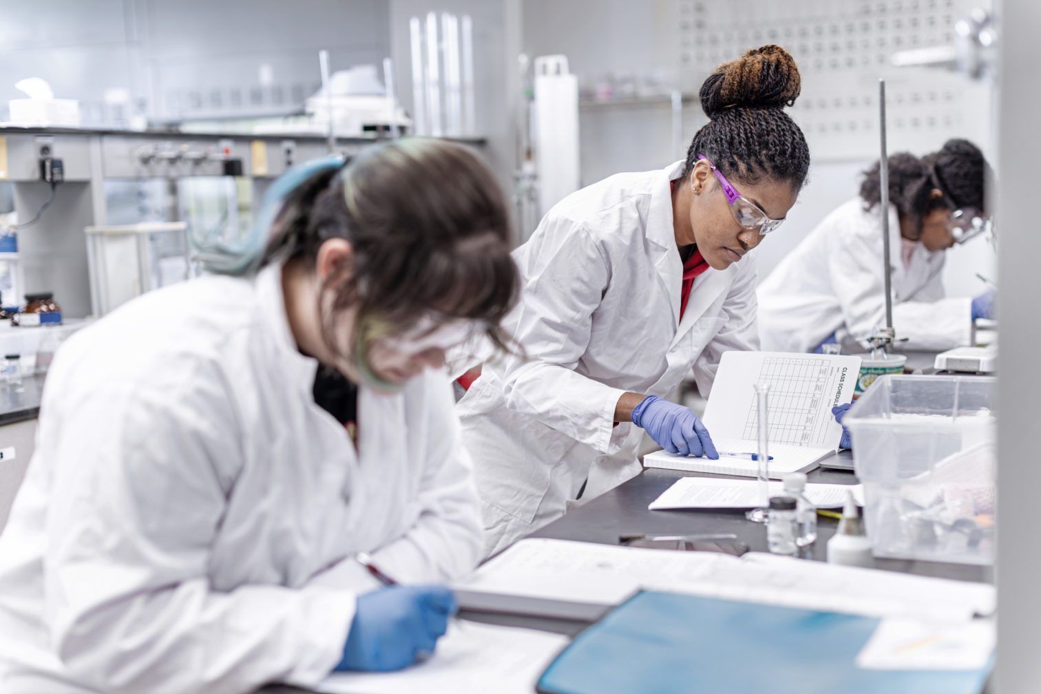 Students in the chemistry lab working on an experiment.