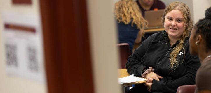Students sitting at desks in a classroom.