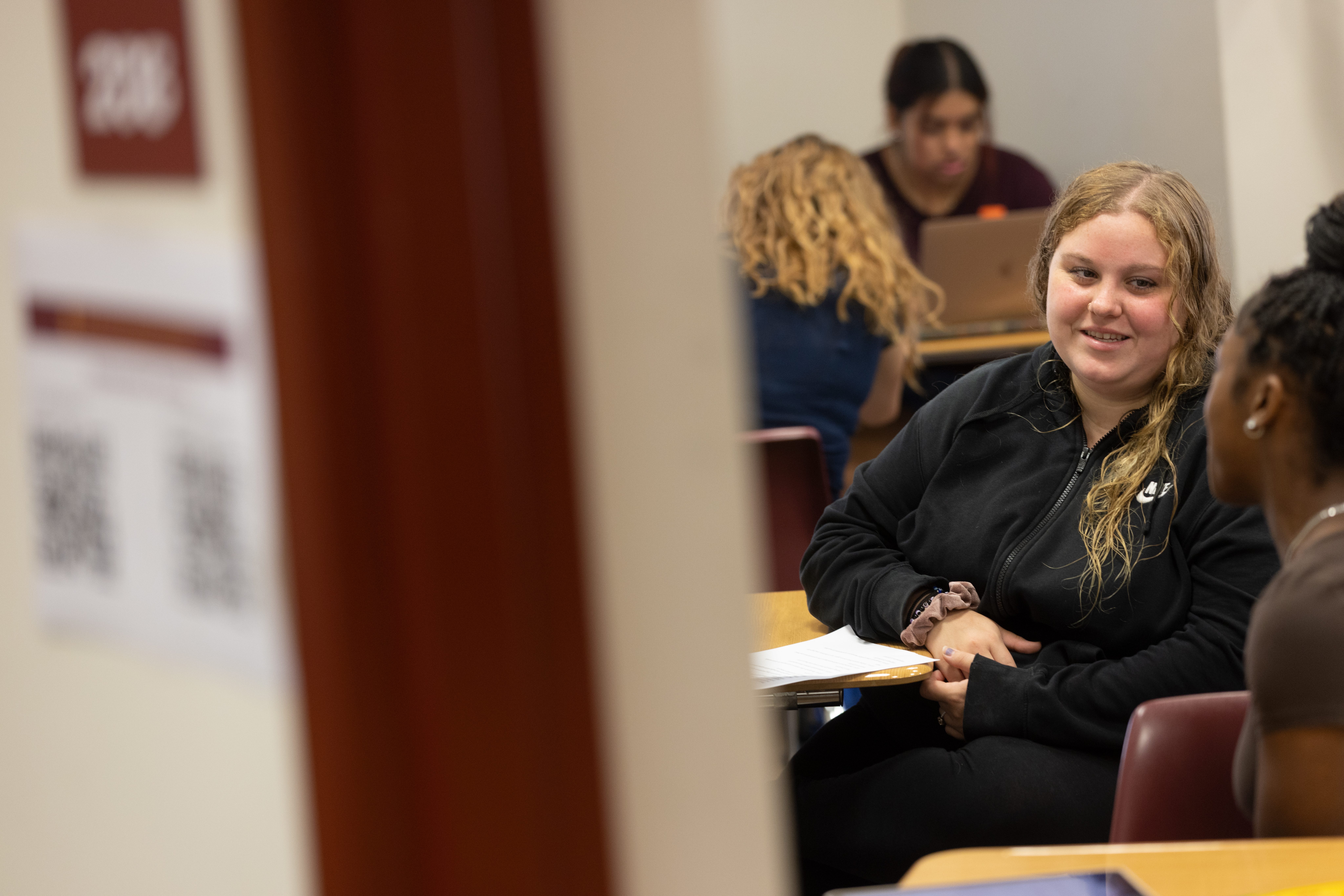 Students sitting at desks in a classroom.