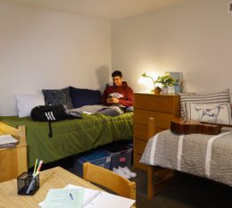 Student in his campus dorm