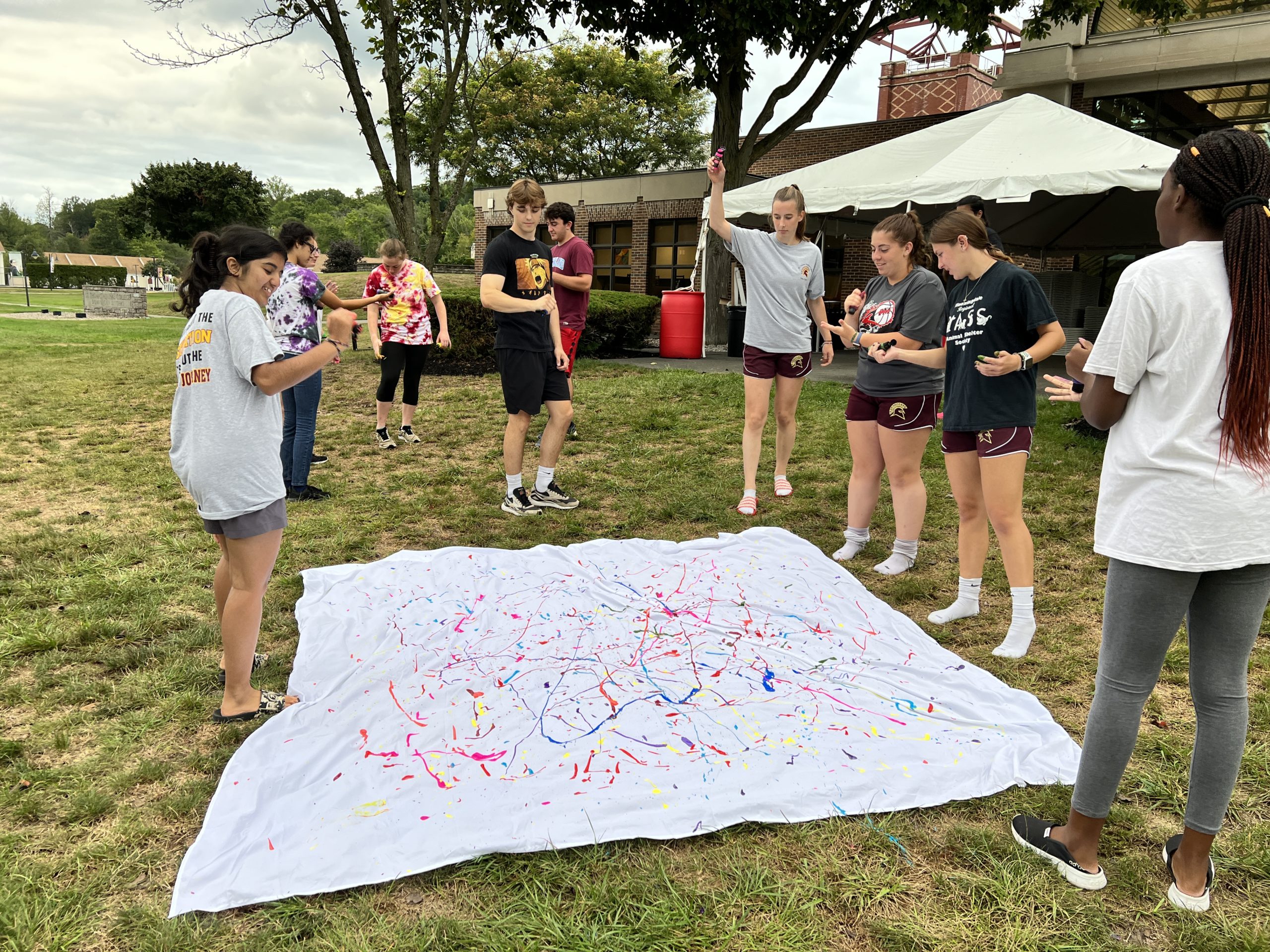 Students doing a painting on campus