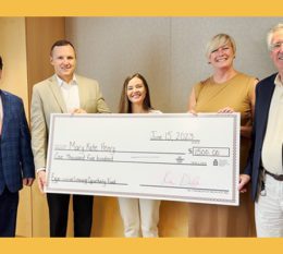 Mary Kate posing with large check alongside STAC President Ken Daly, VP Flood, Prof McDonnell and Dean Murphy smiling