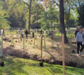 students and community members outside planting trees at Sparkill Creek