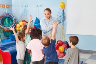 Gym teacher in class with students