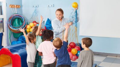 Gym teacher in class with students