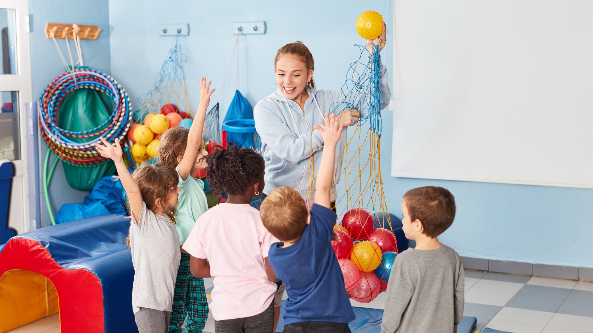 Gym teacher in class with students