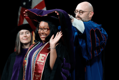 Gianna being hooded at Elon commencement