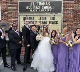 DeCarlo wedding party standing in front of church