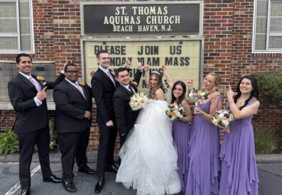 DeCarlo wedding party standing in front of church